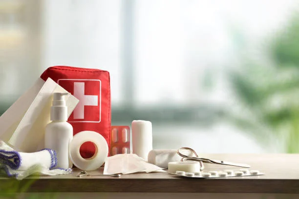Open first aid kit with bandages and emergency supplies